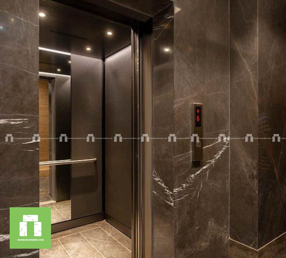 Thi công đá thang máy công ty màu xám sang trọng